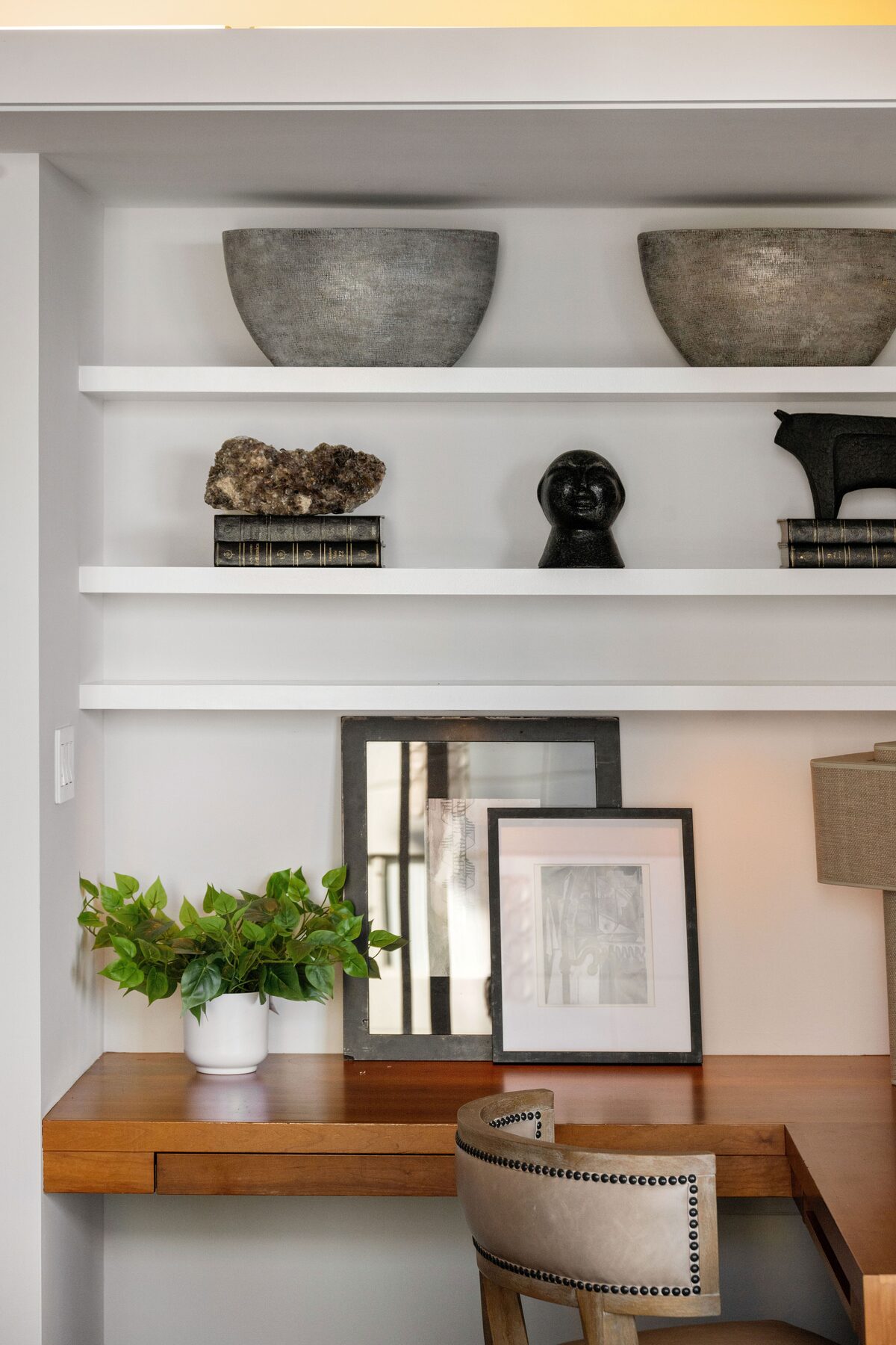 Built-in desk detail with curated shelving