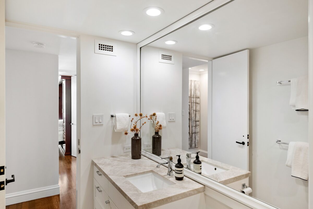 Marble bathroom vanity with modern fixtures