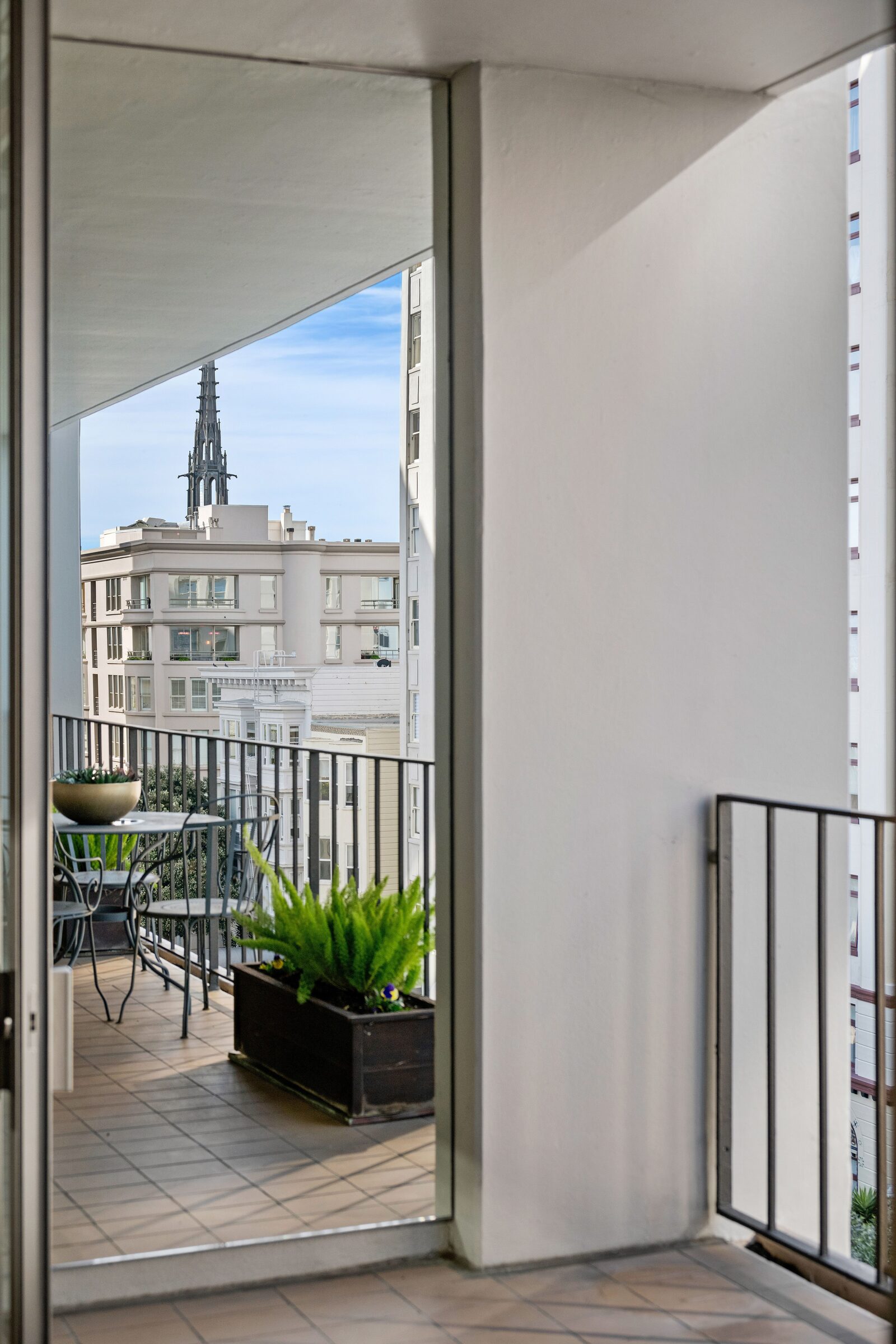 Expansive private balcony with outdoor dining